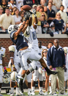 Georgia Tech WR Anthony Autry fights for a pass with Brigham Young DB Preston Hadley