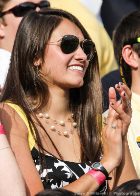 Georgia Tech Fan applauds her team from the north end zone student section