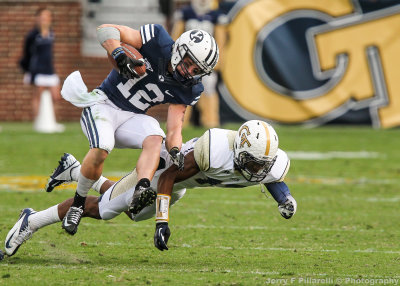 GT DB Demond Smith upends BYU WR JD Falsev on a punt return