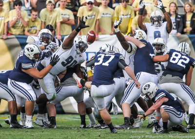 Yellow Jackets DT TJ Barnes attempts to block a BYU field goal