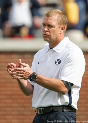 Brigham Young Cougars Head Coach Bronco Mendenhall applauds the play of his team
