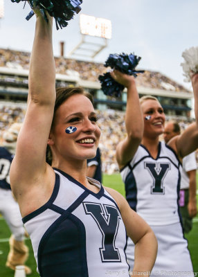 Cougars Cheerleader performs during the game