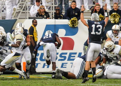 Brigham Young QB Nelson signals the touchdown by RB Jamaal Williams