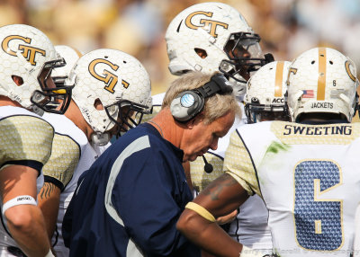 GT Defensive Line Coach Andy McCollum talks to his squad during a break in the action