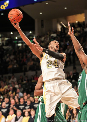 Georgia Tech F Kammeon Holsey takes a short hook shot over a Tulane defender