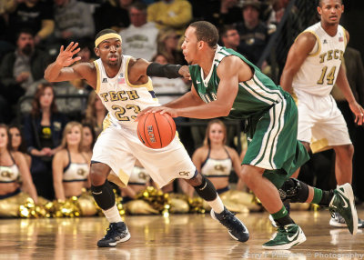 Georgia Tech G Reed stays in front of a Tulane ball handler