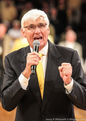 Former Georgia Tech Head Basketball Coach Bobby Cremins talks to the crowd during halftime