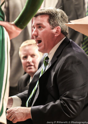 Tulane Green Wave Head Coach Ed Conroy makes a point to his players during a timeout