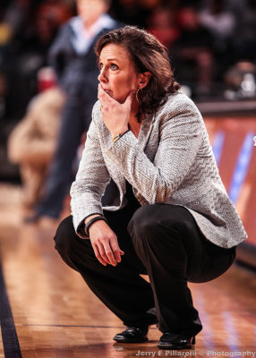 Georgia Tech Head Coach MaChelle Joseph watches the action unfold from in front of the bench