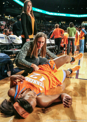 Tennessee F Graves gets assistance from the trainer during the game