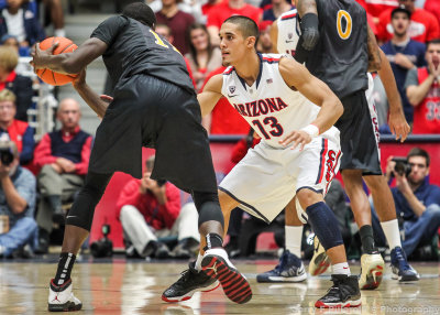 Arizona G Nick Johnson squares up on defense against Long Beach State F James Ennis