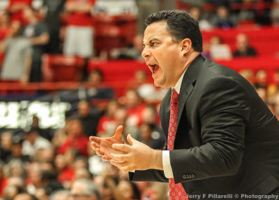 Arizona Head Basketball Coach Sean Miller gives instructions to his team during play