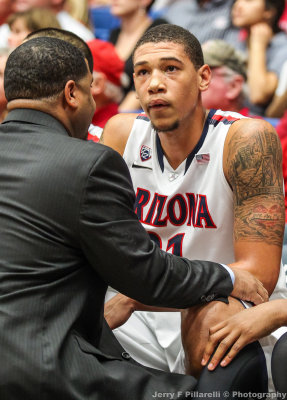 Wildcats F Ashley gets coaching on the bench