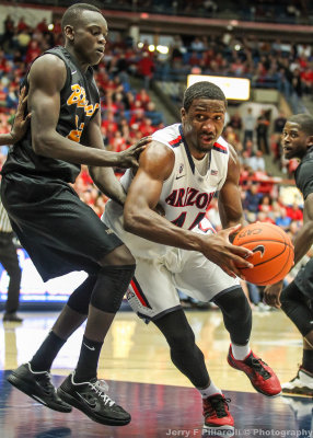 Wildcats F Hill drives the lane past 49ers F Deng Deng