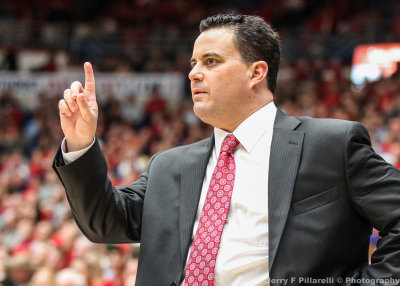 Arizona Head Basketball Coach Sean Miller signals to his team