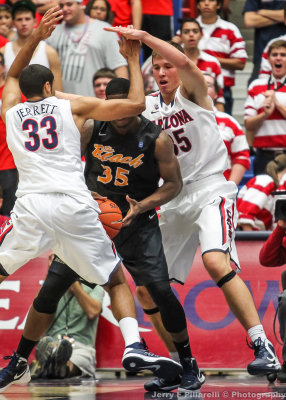 Arizona C Tarczewski and F Jerrett surround Long Beach State F Dan Jennings