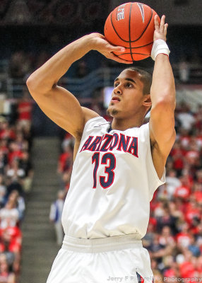 Arizona G Johnson takes a jump shot from just inside the three point arc