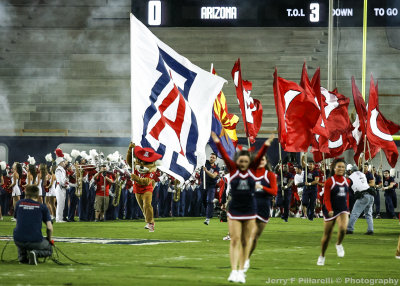 Arizona Mascot Wilbur leads the team onto the field