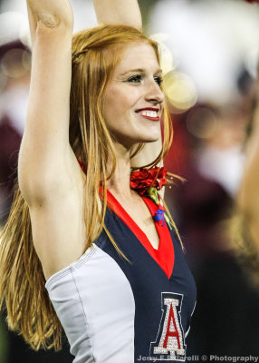 Wildcats Dance team member cheers the arrival of the team
