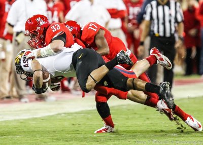 Arizona LB Fisher drives Arizona State RB DJ Foster into the ground