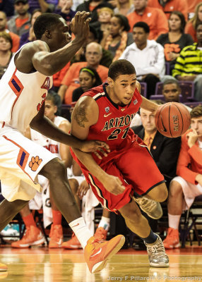 Wildcats F Brandon Ashley drives the baseline against a Tigers defender