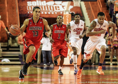 Wildcats G Nick Johnson leads the break at Clemson