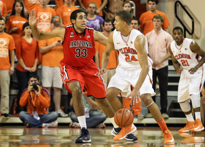 Arizona F Grant Jerrett stays in front of Clemson F Milton Jennings