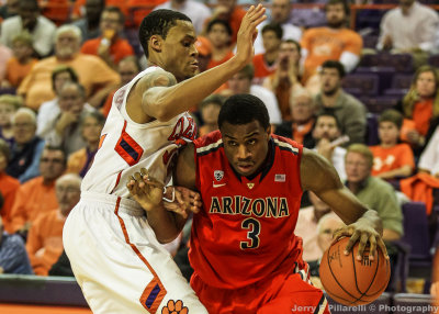 Wildcats G Kevin Parrom drives the baseline on Tigers F KJ McDaniels