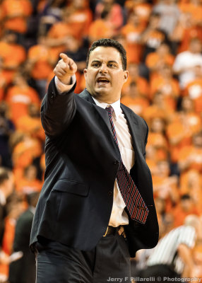 Arizona Head Basketball Coach Sean Miller is framed by a sea of orange as he shouts instructions to his team