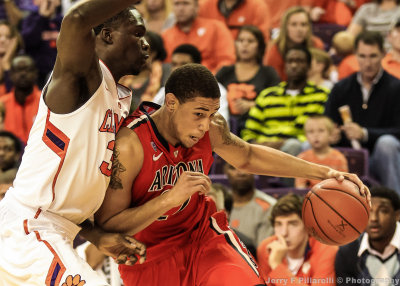 Wildcats F Ashley drives on a Tigers defender