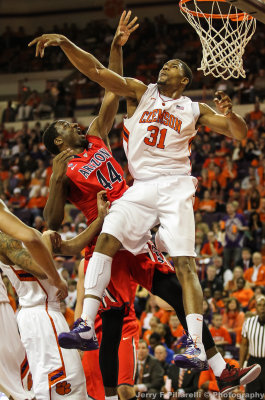 Wildcats F Hill and Tigers F Booker meet under the basket