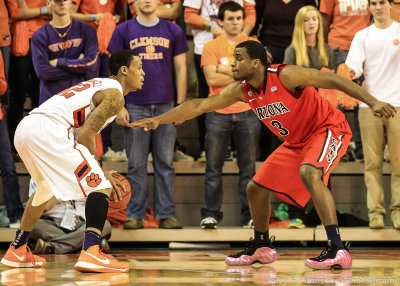 Arizona G Parrom defends Clemson F McDaniels on the perimeter