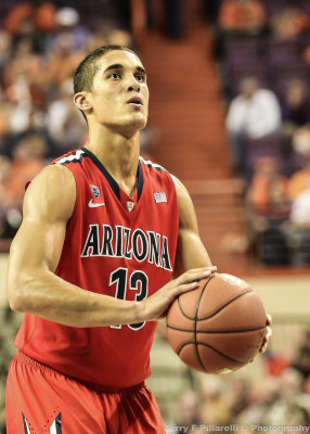Wildcats G Johnson shoots a free throw late in the game to seal the victory