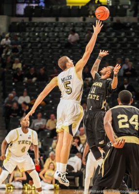 Georgia Tech C Daniel Miller gets the tip against Alabama State F Phillip Crawford