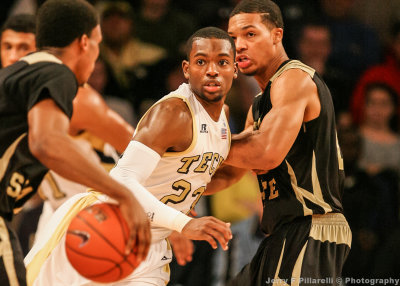 Jackets G Reed fights off a pick to stay with his man on defense