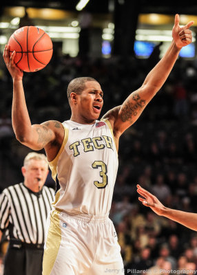 Georgia Tech F Georges-Hunt directs a team member from the top of the key