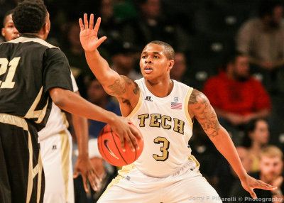 Georgia Tech F Georges-Hunt defends against Alabama State PG McDaniel