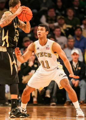 Georgia Tech G Bolden squares up on defense against Alabama State F Patterson