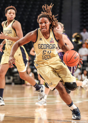 Yellow Jackets F Roddreka Rogers drives the ball over the three point line