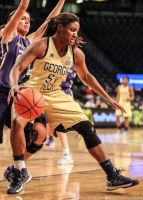 Yellow Jackets F Rogers backs her way into the lane