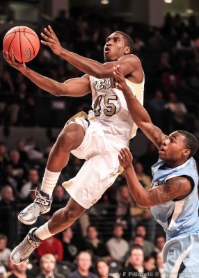…Georgia Tech G Solomon Poole glides past a Citadel defender on the way to the basket…