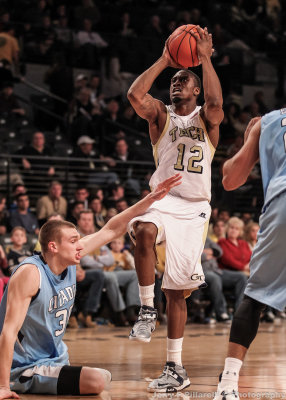 Jackets G Stacey Poole shoots over fallen Bulldogs F Van Scyoc