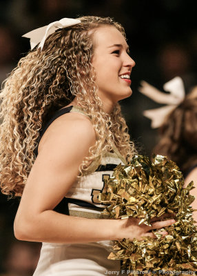 Georgia Tech Cheerleader works the crowd during a timeout