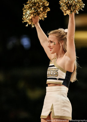 Yellow Jackets Cheerleader during a break in the action