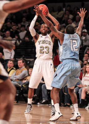 Tech G Reed passes over Bulldogs G Moore