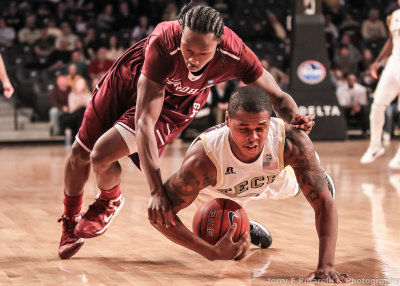 Georgia Tech F Georges-Hunt fights with a Fordham player for possession of a loose ball