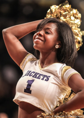 Georgia Tech Yellow Jackets Dance Team Member cheers her team on during a timeout
