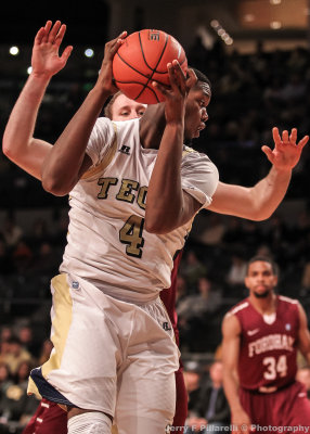 Yellow Jackets F Carter looks to make a move on a Rams defender