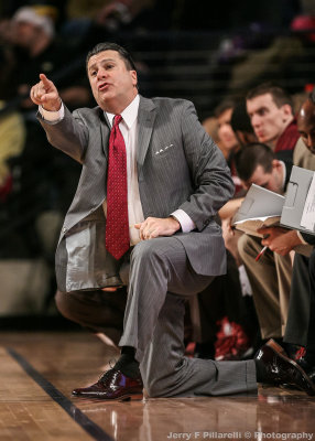 Fordham Rams Head Coach Tom Pecora instructs his team from the bench