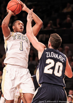 Yellow Jackets F Julian Royal takes a short jump shot over Mocs F Drazen Zlovaric